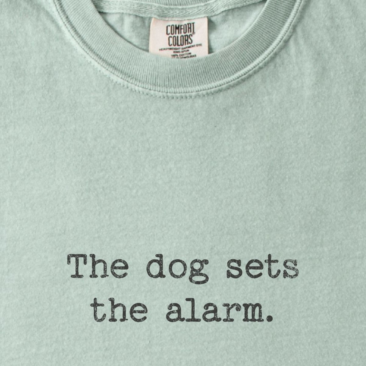 The Dog Sets The Alarm. Premium T-Shirt